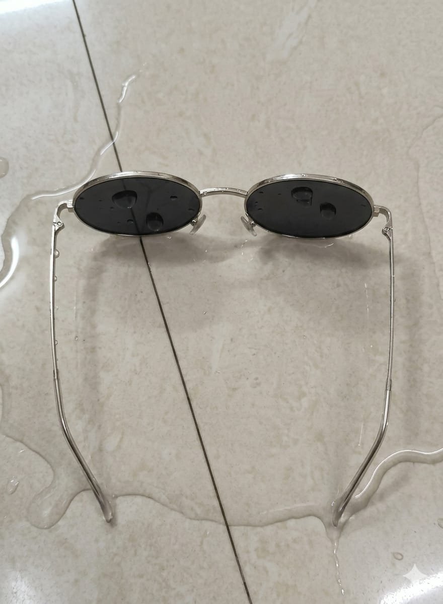 Silver Oval Sunglasses With Dark Lenses